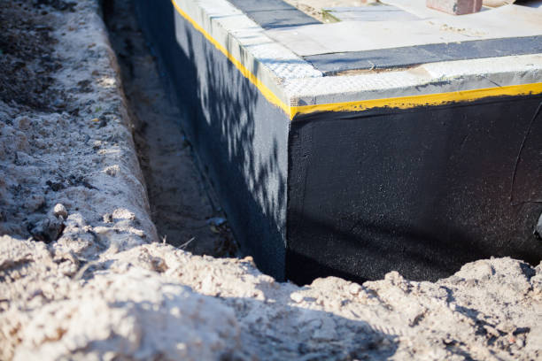 Professional Waterproofing technician working in Barnegat Light, NJ
